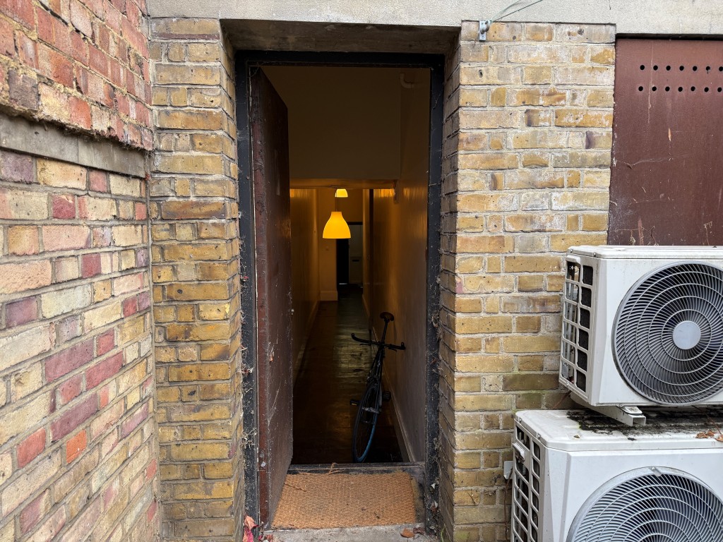 Lot: 44 - LAND WITH POTENTIAL JUST OFF CLAPHAM COMMON - Doorway providing access to rear land